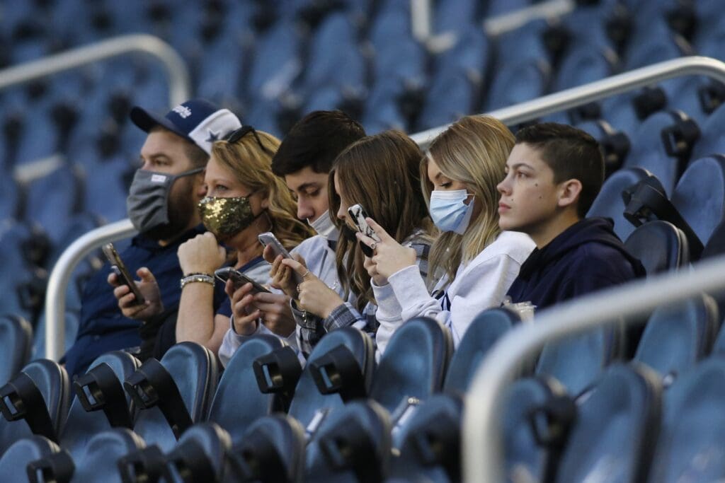 Dec 20, 2020; Arlington, Texas, USA; Dallas Cowboys fans react in the stands before a game against the San Francisco 49ers at AT&T Stadium