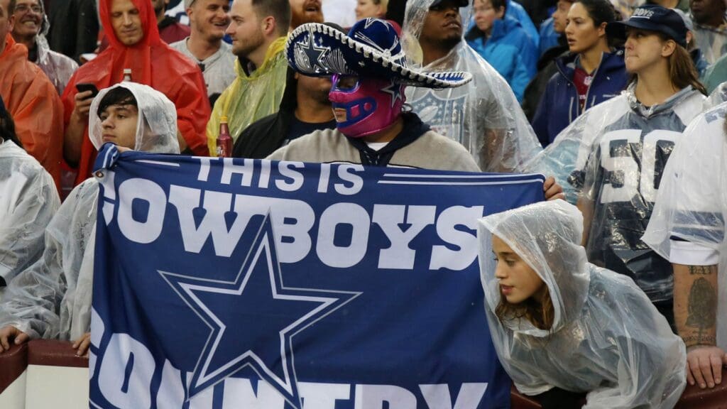 Oct 29, 2017; Landover, MD, USA; A Dallas Cowboys fan holds a flag in the stands against the Washington Redskins at FedEx Field