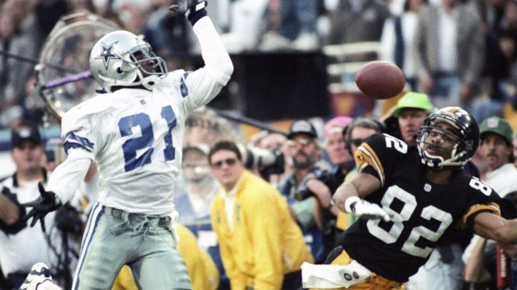 Jan 28, 1996; Tempe, AZ, USA; FILE PHOTO; Dallas Cowboys cornerback Deion Sanders (21) in action against Pittsburgh Steelers receiver Yancey Thigpen (82) during Super Bowl XXX at Sun Devil Stadium. Dallas defeated Pittsburgh 27-17.