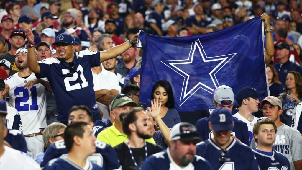 Sep 25, 2017; Glendale, AZ, USA; Dallas Cowboys fan in the crowd holds a flag against the Arizona Cardinals at University of Phoenix Stadium