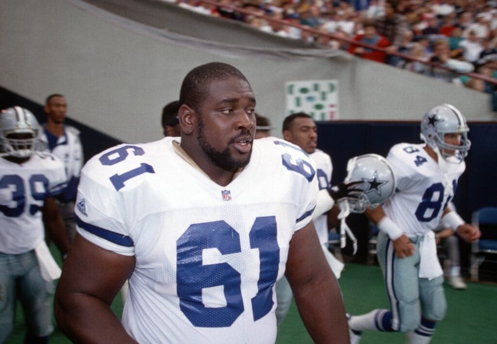 Dallas Cowboys guard Nate Newton (61) coming out of the tunnel with his team before the game against the Indianapolis Colts at the RCA Dome.