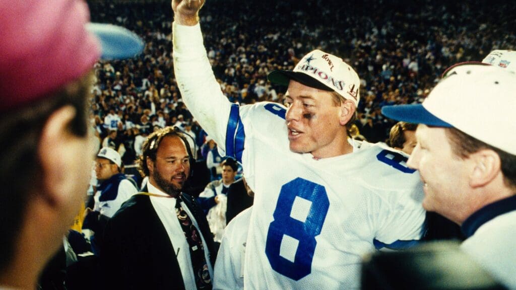Jan 31, 1993; Pasadena, CA, USA; FILE PHOTO; Dallas Cowboys quarterback Troy Aikman (8) celebrates after defeating the Buffalo Bills during Super Bowl XXVII at the Rose Bowl. The Cowboys defeated the Bills 52-17