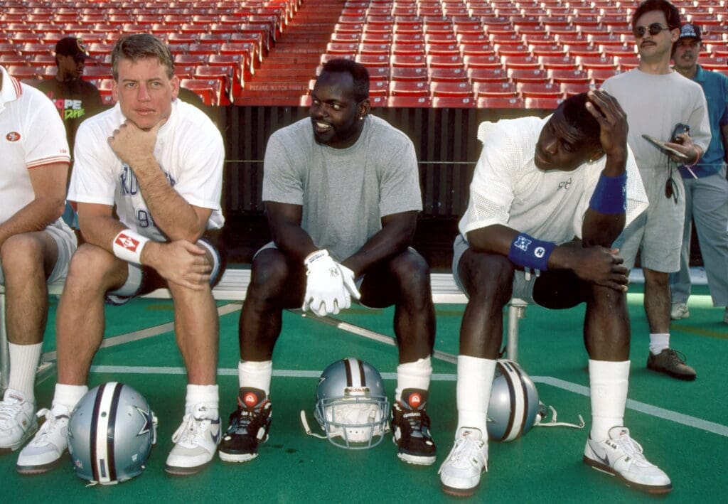 Dallas Cowboys quarterback Troy Aikman (left), and running back Emmitt Smith (center) and receiver Michael Irvin (right) before the 1992 Pro Bowl practice at Aloha Stadium.