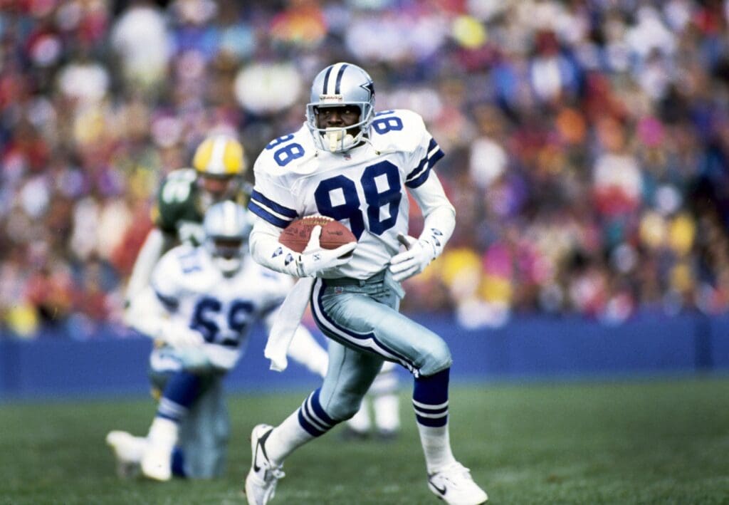 Oct 6, 1991; Green Bay, WI, USA; Dallas Cowboys receiver Michael Irvin (88) runs with the ball against the Green Bay Packers at Lambeau Field.