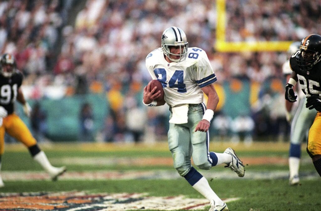 Jan 28, 1996; Tempe, AZ, USA; FILE PHOTO; Dallas Cowboys tight end Jay Novacek (84) carries the ball against Pittsburgh Steelers linebacker Greg Lloyd (95) during Super Bowl XXX at Sun Devil Stadium. Dallas defeated Pittsburgh 27-17.