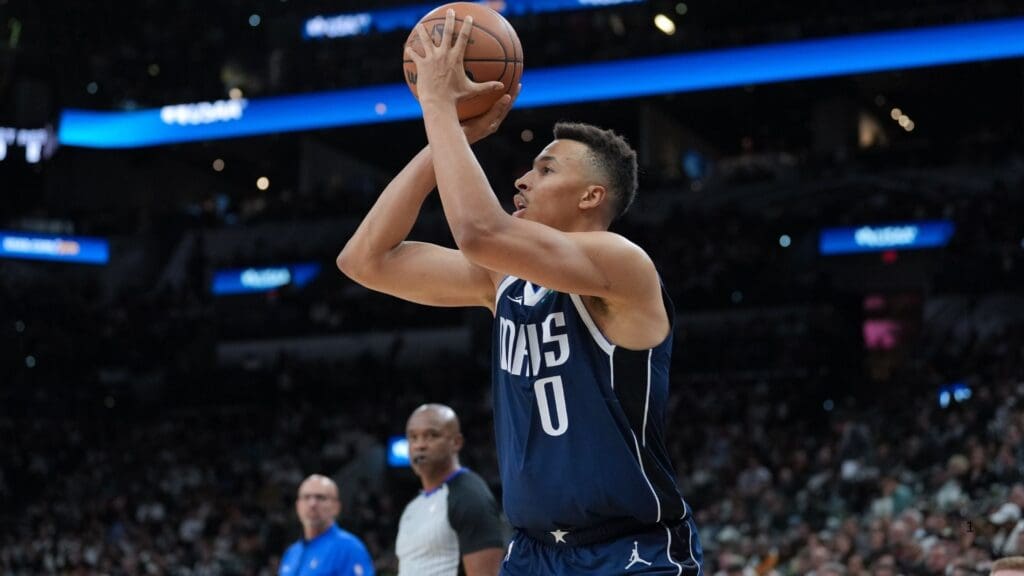 Oct 25, 2023; San Antonio, Texas, USA; Dallas Mavericks guard Dante Exum (0) shoots in the first half against the San Antonio Spurs at the Frost Bank Center.