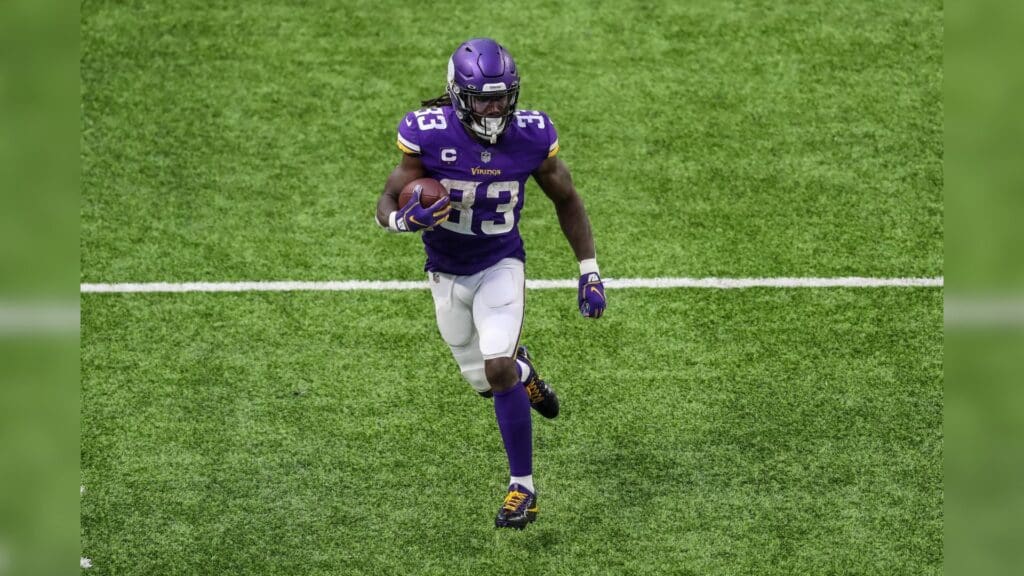 Dec 20, 2020; Minneapolis, Minnesota, USA; Minnesota Vikings running back Dalvin Cook (33) runs the ball during the third quarter against the Chicago Bears at U.S. Bank Stadium.