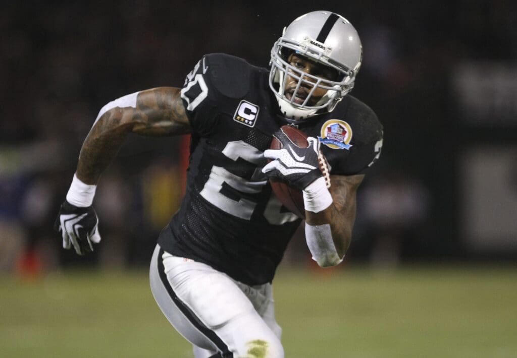 Dec 6, 2012; Oakland, CA, USA; Oakland Raiders wide receiver Darrius Heyward-Bey (85) carries the ball for a touchdown against the Denver Broncos during the second quarter at O.co Coliseum.
