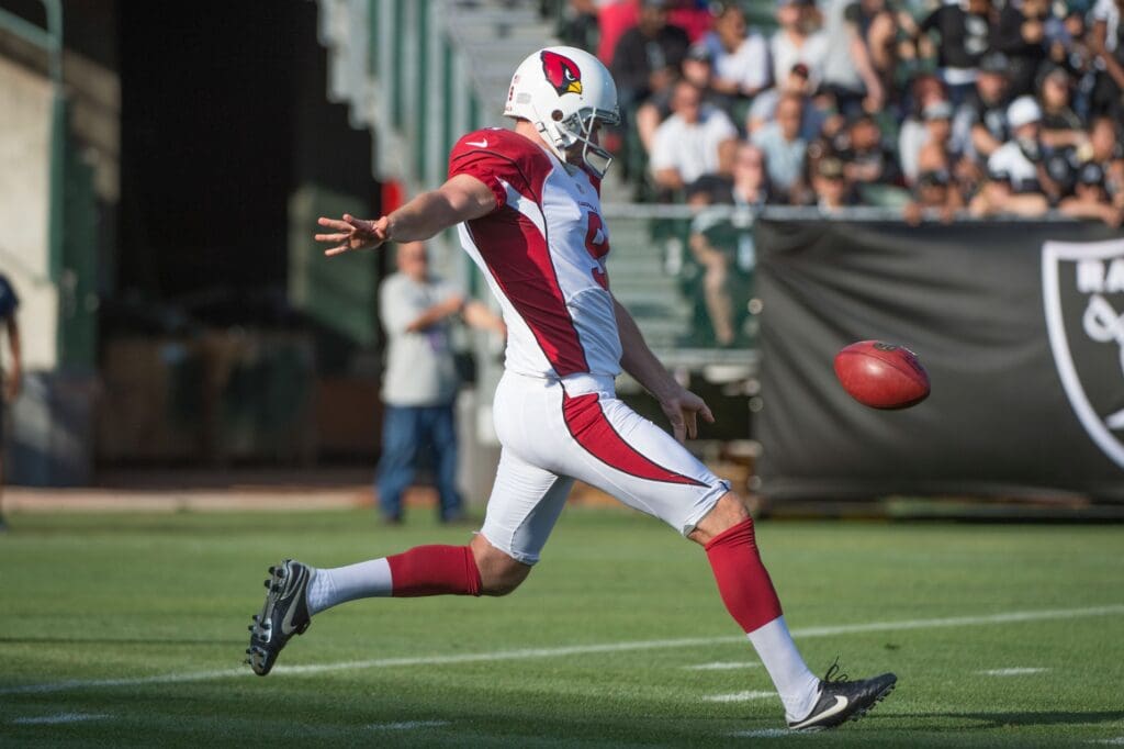 August 30, 2015; Oakland, CA, USA; Arizona Cardinals punter Dave Zastudil (9) kicks the football during the first quarter in a preseason NFL football game against the Oakland Raiders at O.co Coliseum. The Cardinals defeated the Raiders 30-23.