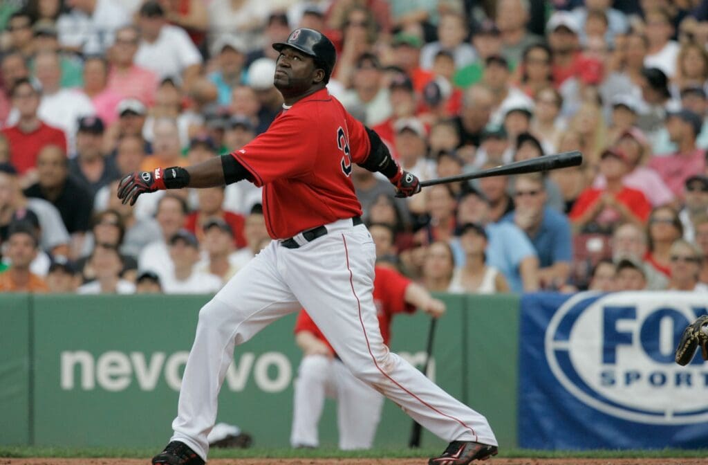 July 26, 2008; Boston, MA, USA; Boston Red Sox designated hitter David Ortiz (34) gets a base hit in the fifth inning against the New York Yankees at Fenway Park.