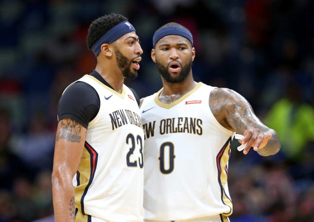 Nov 13, 2017; New Orleans, LA, USA; New Orleans Pelicans forward Anthony Davis (23) talks to center DeMarcus Cousins (0) in the second quarter against the Atlanta Hawks at the Smoothie King Center.