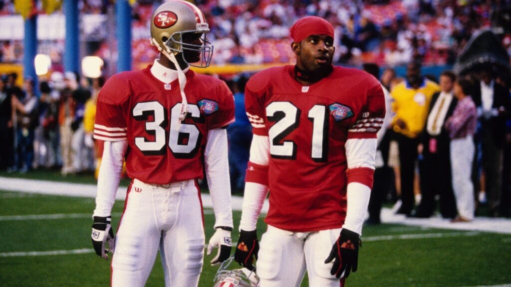 Jan 29, 1995; Miami, FL, USA; FILE PHOTO; San Francisco 49ers safety Merton Hanks (36) and cornerback Deion Sanders (21) on the field prior to Super Bowl XXIX against the San Diego Chargers at Joe Robbie Stadium. The 49ers defeated the Chargers 49-26.