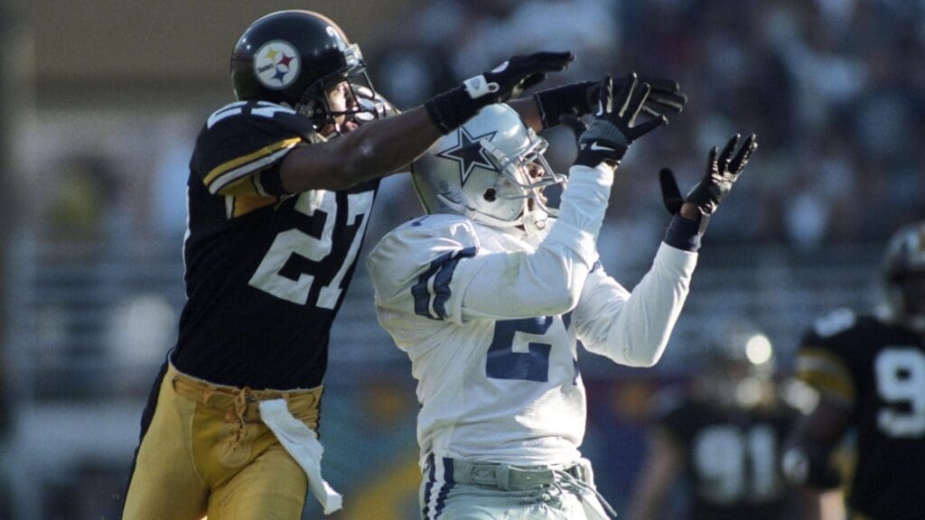 Jan 28, 1996; Tempe, AZ, USA; FILE PHOTO; Dallas Cowboys receiver Deion Sanders (21) in action against Pittsburgh Steelers cornerback Willie Williams (27) during Super Bowl XXX at the Sun Devil Stadium. The Cowboys defeated the Steelers 27-17.