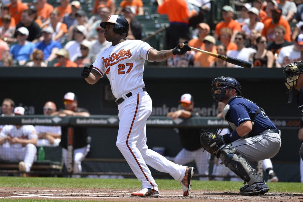 May 31, 2015; Baltimore, MD, USA; Baltimore Orioles right fielder Delmon Young (27) hits a solo home run in the first inning against the Tampa Bay Rays at Oriole Park at Camden Yards.
