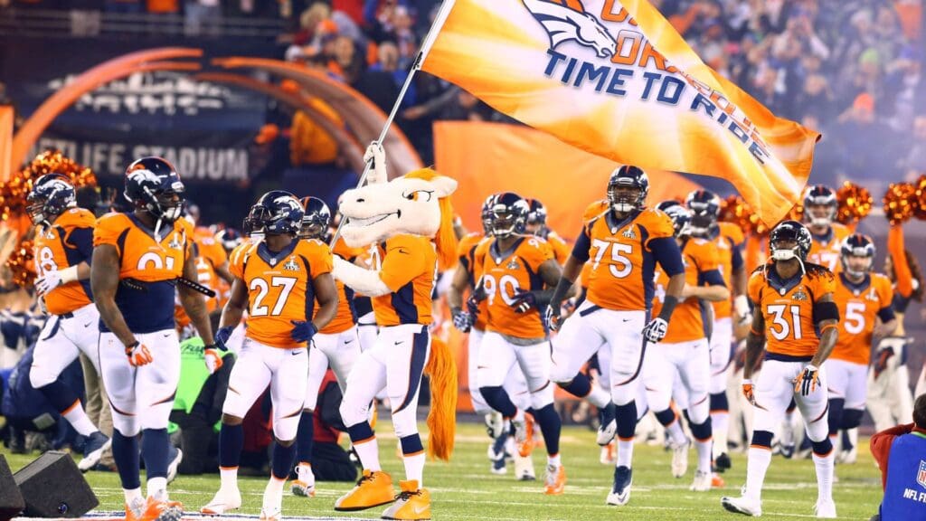 Feb 2, 2014; East Rutherford, NJ, USA; Denver Broncos mascot Miles leads the team onto the field prior to the game against the Seattle Seahawks in Super Bowl XLVIII at MetLife Stadium.