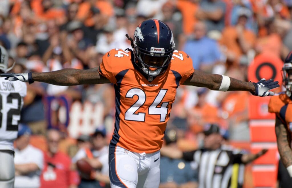Sep 16, 2018; Denver, CO, USA; Denver Broncos defensive back Adam Jones (24) reacts against the Oakland Raiders during the first half at Broncos Stadium at Mile High