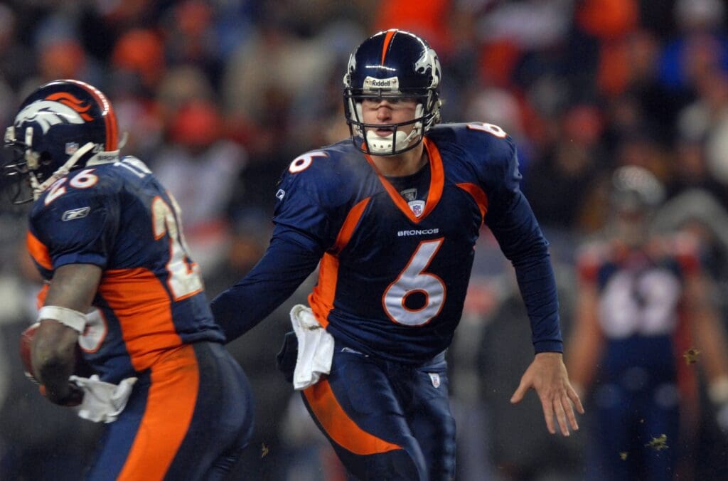Dec. 3, 2006; Denver, CO, USA; Denver Broncos quarterback (6) Jay Cutler hands off the ball to running back (26) Tatum Bell against the Seattle Seahawks at Invesco Field at Mile High in Denver, Colorado. Seattle defeated Denver 23-20.
