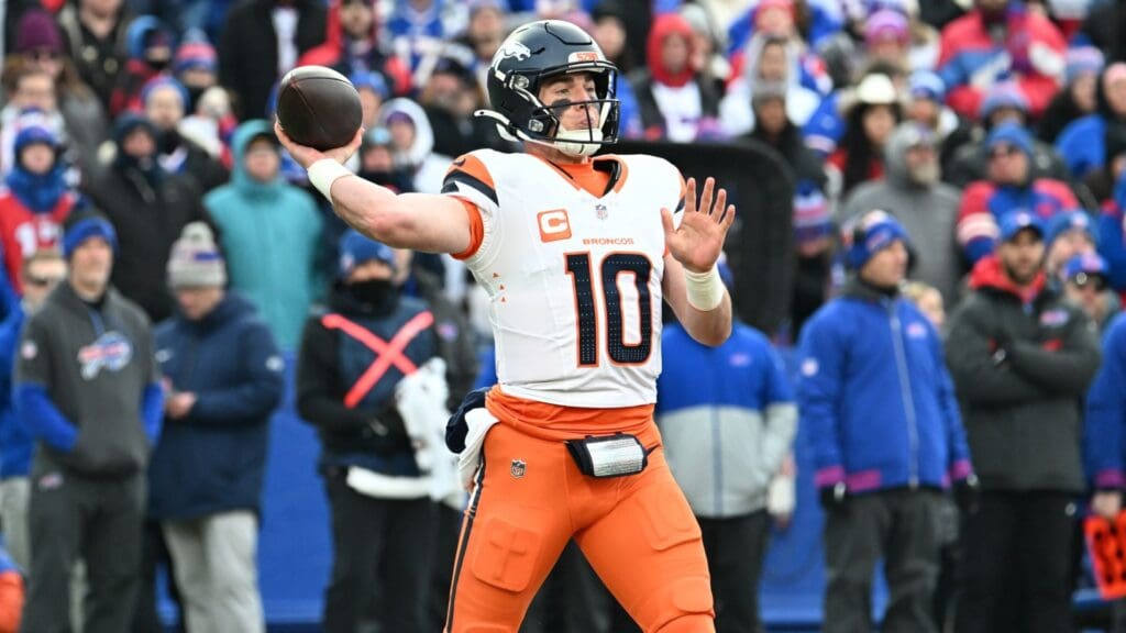 Jan 12, 2025; Orchard Park, New York, USA; Denver Broncos quarterback Bo Nix (10) throws downfield during the fourth quarter against the Buffalo Bills in an AFC wild card game at Highmark Stadium