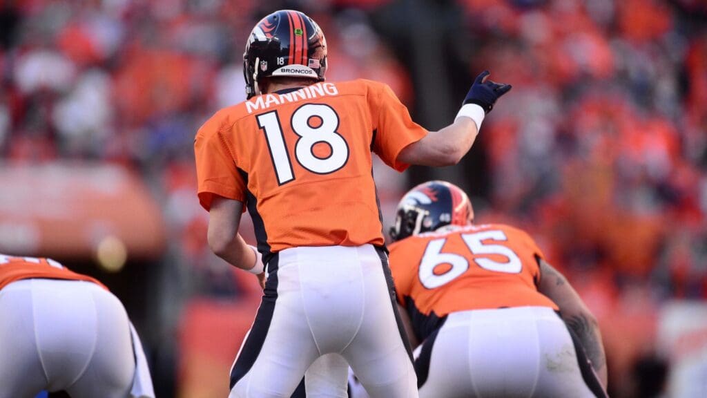 January 19, 2014; Denver, CO, USA; Denver Broncos quarterback Peyton Manning (18) audibles in the first of the game against the New England Patriots of the 2013 AFC Championship football game at Sports Authority Field at Mile High