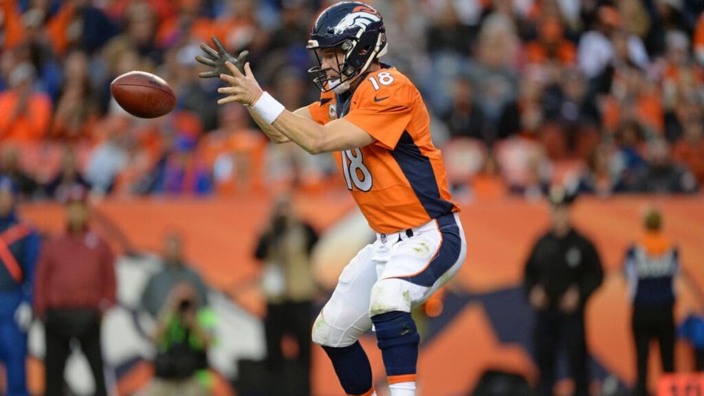 Nov 15, 2015; Denver, CO, USA; Denver Broncos quarterback Peyton Manning (18) prepares to take a snap of the football in the third quarter against the Kansas City Chiefs at Sports Authority Field at Mile High