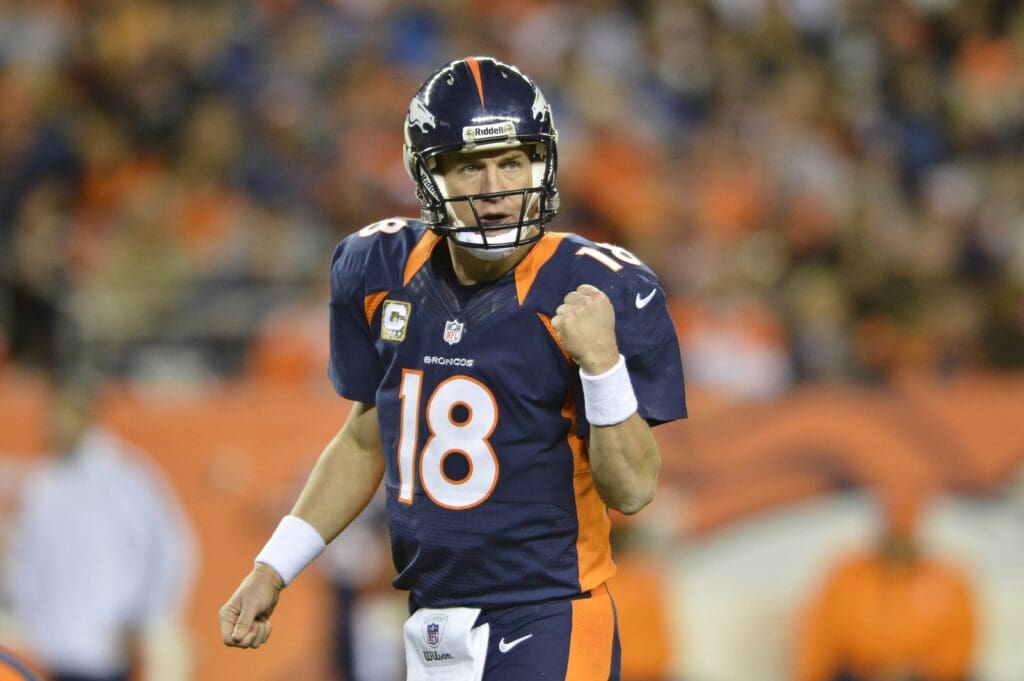 Nov 18 2012; Denver, CO, USA; Denver Broncos quarterback Peyton Manning (18) checks off at the line of scrimmage during the fourth quarter of the game against the San Diego Chargers at Sports Authority Field. The Broncos defeated the Chargers 30-23.