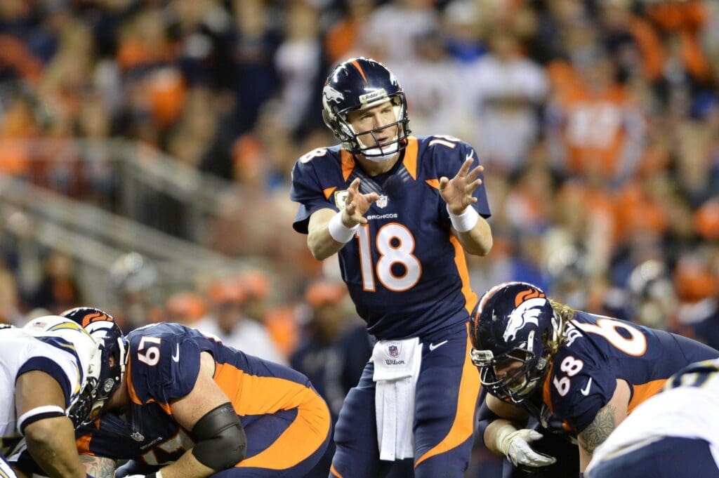 Nov 18 2012; Denver, CO, USA; Denver Broncos quarterback Peyton Manning (18) checks off at the line of scrimmage during the fourth quarter of the game against the San Diego Chargers at Sports Authority Field. The Broncos defeated the Chargers 30-23.