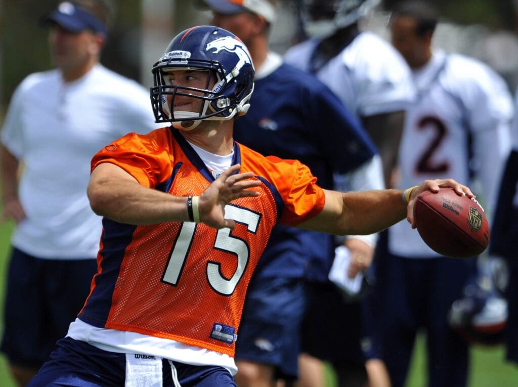 May 27, 2010; Englewood, CO, USA; Denver Broncos quarterback Tim Tebow (15) prepares to throw the football during organized team activities held at the Denver Broncos practice facility.