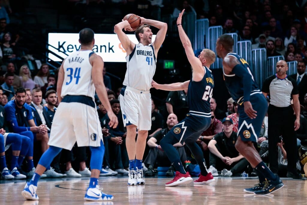 Mar 14, 2019; Denver, CO, USA; Denver Nuggets forward Mason Plumlee (24) defends against forward Dirk Nowitzki (41) in the second quarter at the Pepsi Center.