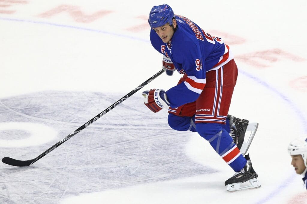 Oct 21, 2010; Toronto, ON, Canada; New York Rangers left wing Derek Boogaard (94) chases the puck against the Toronto Maple Leafs at the Air Canada Centre.