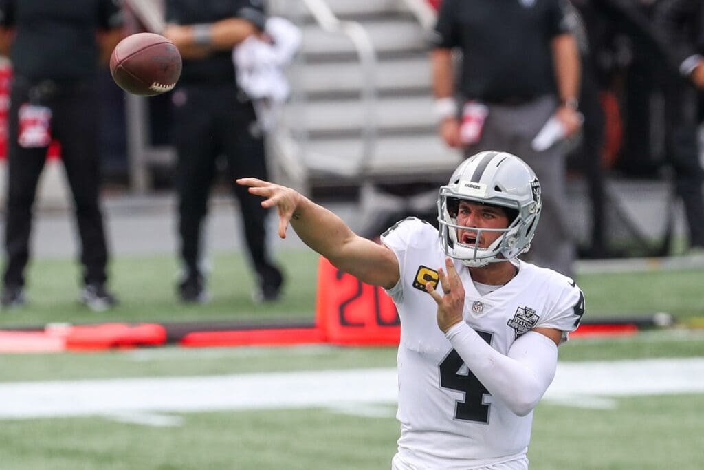 Sep 27, 2020; Foxborough, Massachusetts, USA; Las Vegas Raiders quarterback Derek Carr (4) passes the ball during the first half against the New England Patriots at Gillette Stadium.