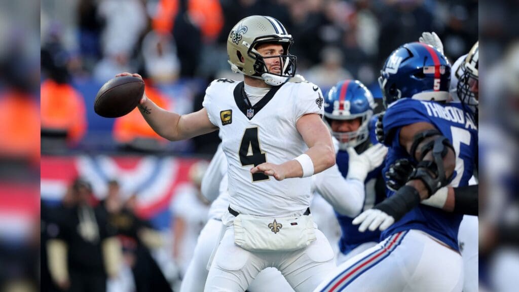 Dec 8, 2024; East Rutherford, New Jersey, USA; New Orleans Saints quarterback Derek Carr (4) drops back to pass against the New York Giants during the third quarter at MetLife Stadium.