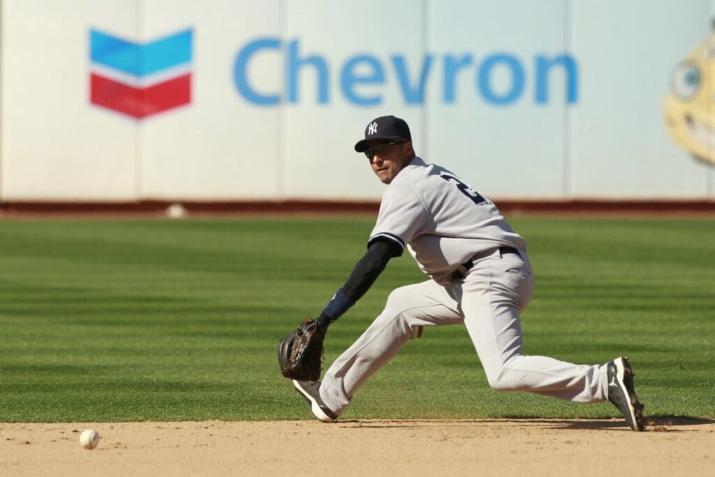 July 22, 2012; Oakland, CA, USA; New York Yankees infielder Derek Jeter (2) is unable to field a single by Oakland Athletics catcher Derek Norris (not pictured) in the twelfth inning at O.co Coliseum. The Athletics defeated the Yankees 5-4.