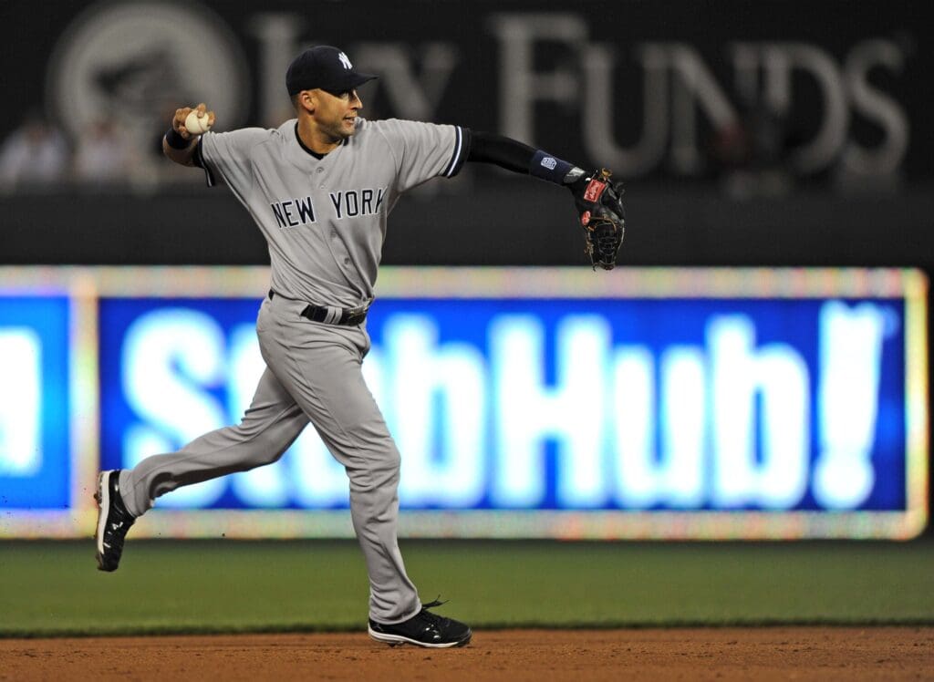 May 4, 2012; Kansas City, MO, USA; New York Yankees shortstop Derek Jeter (2) makes a throw to first against the Kansas City Royals during the sixth inning at Kauffman Stadium.