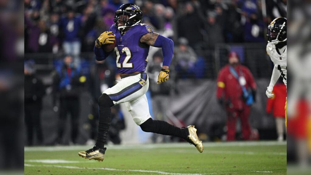 Jan 11, 2025; Baltimore, Maryland, USA; Baltimore Ravens running back Derrick Henry (22) runs to score a touchdown against the Pittsburgh Steelers in the third quarter in an AFC wild card game at M&T Bank Stadium.