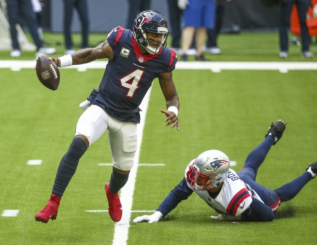 Nov 22, 2020; Houston, Texas, USA; Houston Texans quarterback Deshaun Watson (4) runs with the ball as New England Patriots defensive end Tashawn Bower (96) attempts to make a tackle during the first quarter at NRG Stadium.