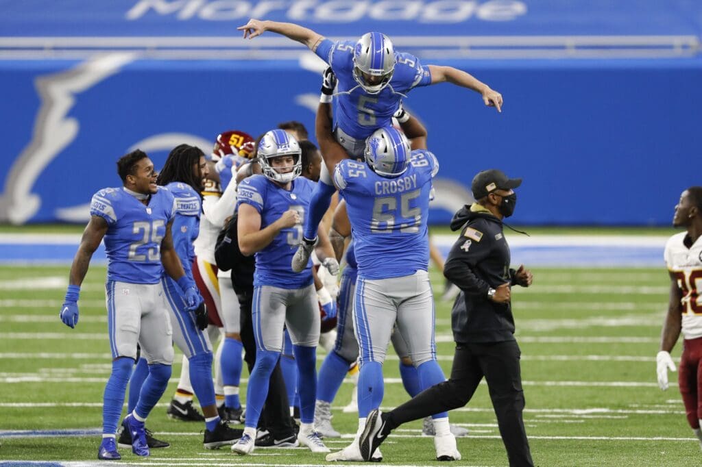 Nov 15, 2020; Detroit, Michigan, USA; Detroit Lions kicker Matt Prater (5) is lifted up in the air by offensive tackle Tyrell Crosby (65) after making the game winning field goal against the Washington Football Team at Ford Field.