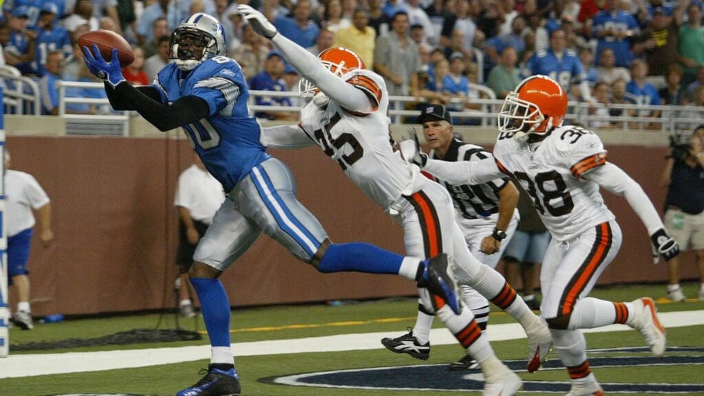 Aug 20, 2005; Detroit, MI, USA; Detroit Lions #80 Charles Rogers catches a touchdown from #5 Jeff Garcia against the Cleveland Browns #25 Chris Crocker and #38 Ray Mikens to put the Lions up 10-7 in the first half at Ford Field