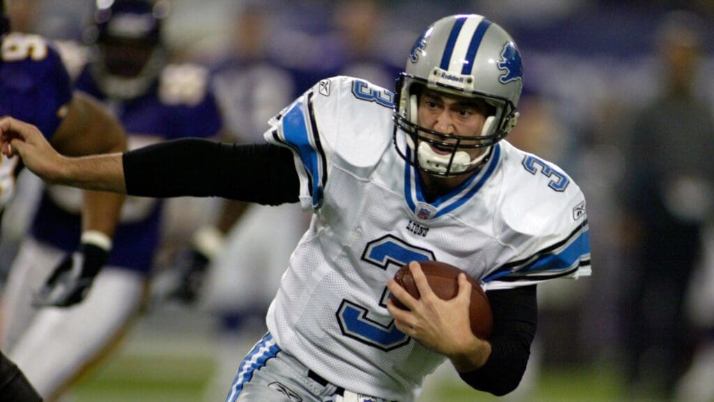 Nov 21, 2004; Minneapolis, MN, USA; Detroit Lions quarterback #3 Joey Harrington goes for a nine-yard gain in 1st half action at the Metrodome. The Lions lead at half 17-7.