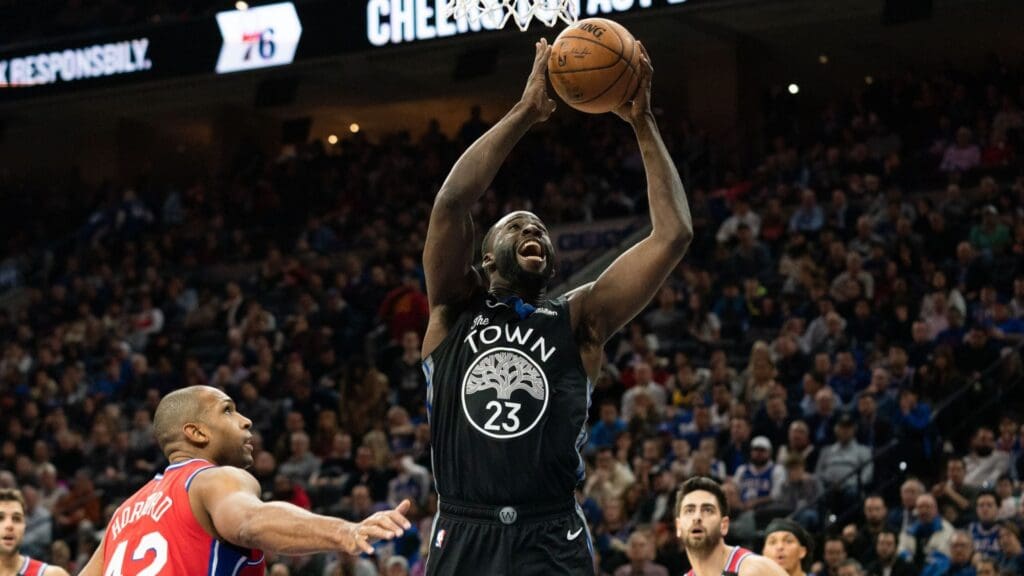 Jan 28, 2020; Philadelphia, Pennsylvania, USA; Golden State Warriors forward Draymond Green (23) drives for a shot past Philadelphia 76ers forward Al Horford (42) during the second quarter at Wells Fargo Center