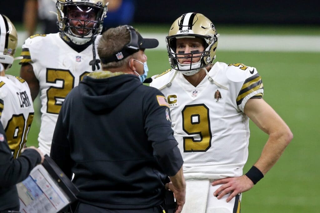 New Orleans Saints quarterback Drew Brees (9) and head coach Sean Payton talk in the second quarter against the Minnesota Vikings at the Mercedes-Benz Superdome.
