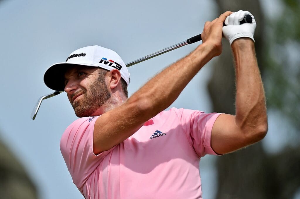 May 13, 2018; Ponte Vedra Beach, FL, USA; Dustin Johnson plays his shot from the third tee during the final round of The Players Championship golf tournament at TPC Sawgrass - Stadium Course.