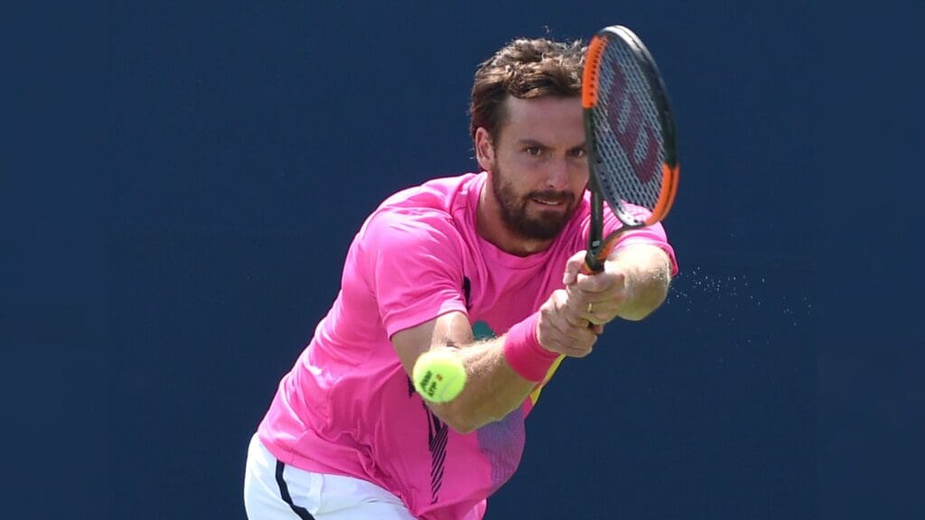 Aug 4, 2018; Toronto, Ontario, Canada; Ernests Gulbis of Latvia hits a shot against Ryan Harrison of the USA (not shown) in the Rogers Cup tennis tournament at Aviva Centre.