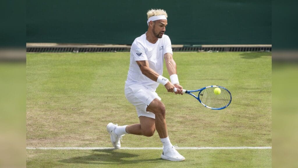 Jul 3, 2024; London, United Kingdom; Fabio Fognini of Italy returns a shot during his match against Casper Ruud of Norway (not shown) on day three of The Championships at All England Lawn Tennis and Croquet Club.