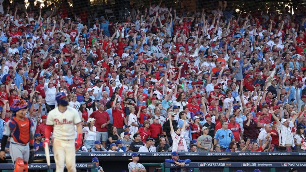 Oct 6, 2024; Philadelphia, Pennsylvania, USA; Fan reacts after Philadelphia Phillies first base Bryce Harper (3) hits a two RBI home-run in the sixth inning against the New York Mets during game two of the NLDS for the 2024 MLB Playoffs at Citizens Bank Park.