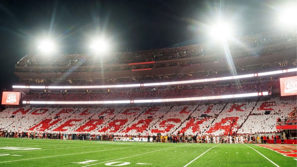 Fans hold cards to commemorate the 400th consecutive sellout after the first quarter between the Nebraska Cornhuskers and the Illinois Fighting Illini at Memorial Stadium.