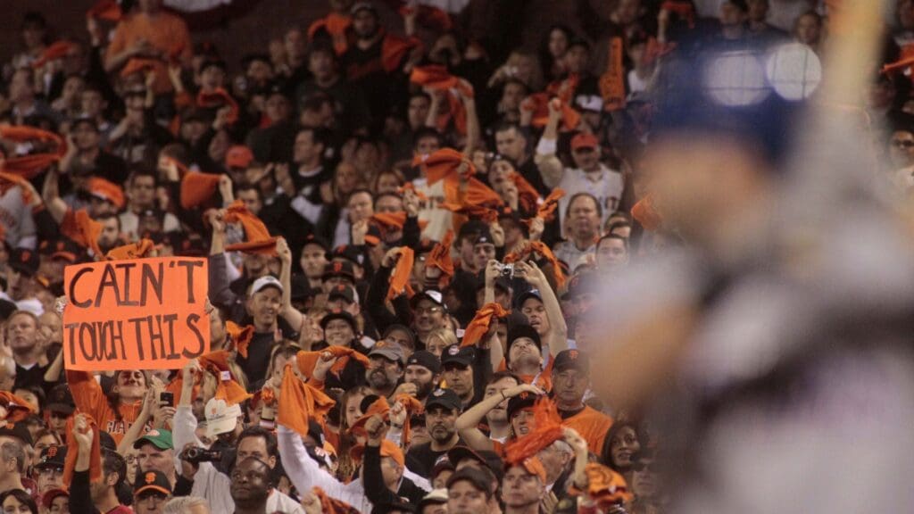 Oct 28, 2010; San Francisco, CA, USA; Fans of the San Francisco Giants cheer and hold up signs during the seventh inning in game two of the 2010 World Series against the Texas Rangers at AT&T Park