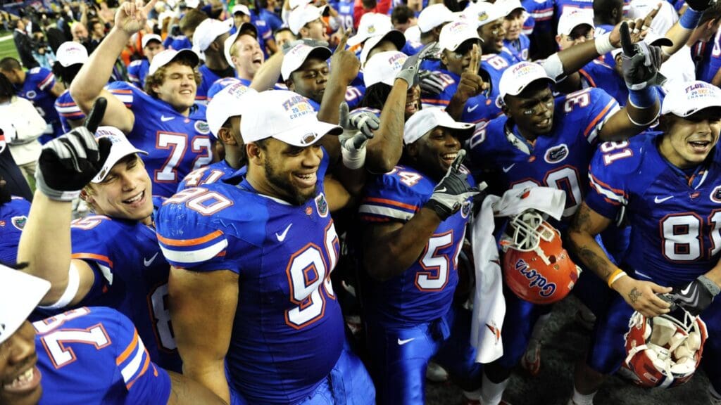 Dec 6, 2008; Atlanta, GA, USA; Florida Gators defensive end Lawrence Marsh (90) and linebacker Roderick Blackett (54) celebrate with their team mates after Florida's win over the Alabama Crimson Tide at the SEC Championship game at the Georgia Dome. Florida defeated Alabama 31-20.