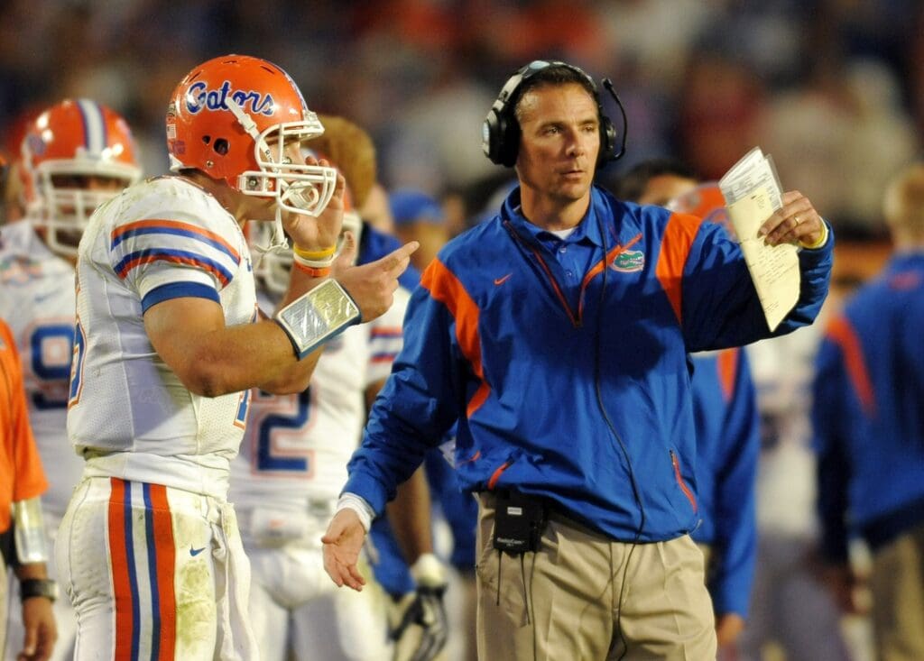 Jan 8, 2009; Miami, FL, USA; Florida Gators coach Urban Meyer talks with quarterback Tim Tebow (15) during the fourth quarter of the 2009 BCS Championship Game against the Oklahoma Sooners at Dolphin Stadium.