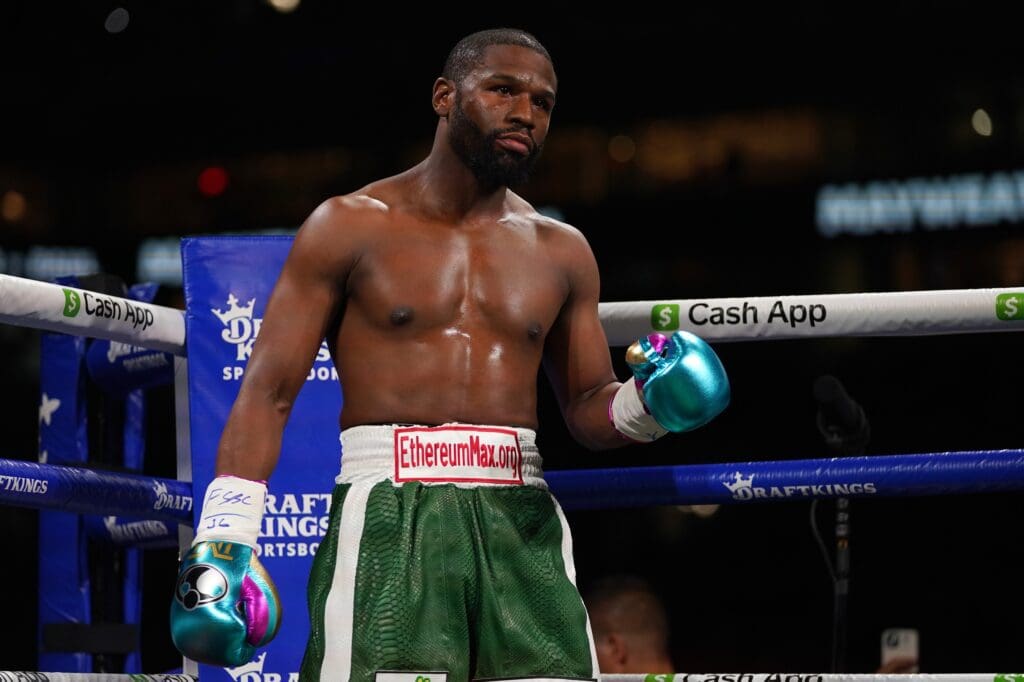 Jun 6, 2021; Miami, Florida, USA; Floyd Mayweather Jr. (Green Trunks) stands in the ring prior to his fight against Logan Paul (not pictured) at Hard Rock Stadium.