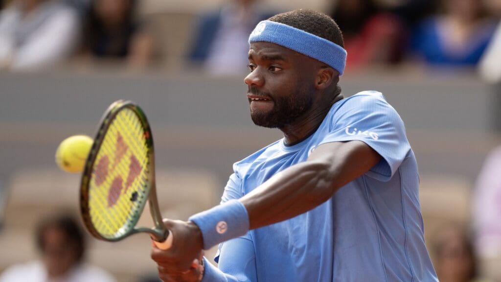 Jun 3, 2025; Paris, FR; Frances Tiafoe of the United States returns a shot during his match against Lorenzo Musetti of Italy on day 10 at Roland Garros Stadium.